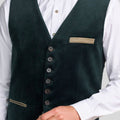 Dark green vest with buttons and a pocket square worn over a white shirt.