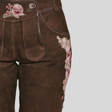 Lederhosen woman attire – traditional Bavarian dress for Oktoberfest festivities