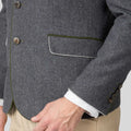 Gray blazer with a pocket detail on a neutral background