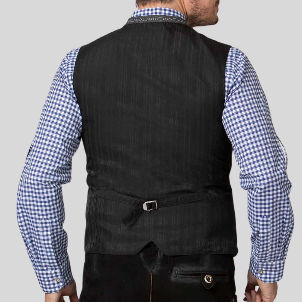 A man shown from the back wearing a black pinstriped waistcoat over a blue and white gingham check shirt, against a solid light gray background.