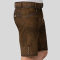 Brown suede shorts with buttons on a gray background