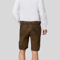 Brown shorts worn by a person on a light gray background