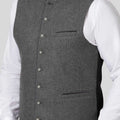Gray vest with buttons on a white background